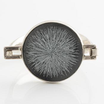 Bangle, silver with inset stone/flower.