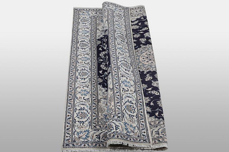A carpet, Nain, part silk, ca 310 x 205 cm.