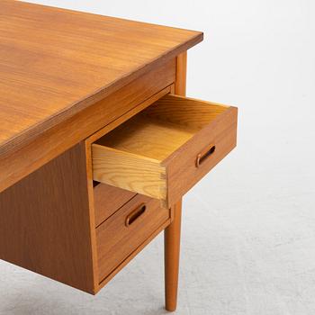 A teak veneered desk, 1950's/60's.