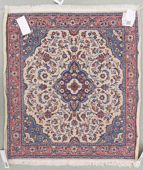 An old rug from Sarouk. Around 76 x 68 cm.