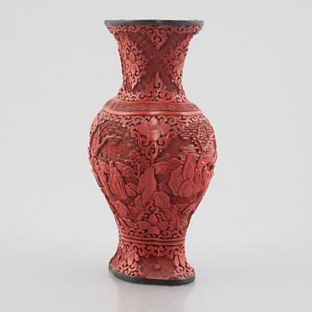A red laquer vase, early 20th century.