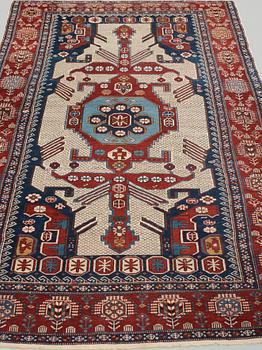 A CARPET, an antique/semi-antique Shirvan, ca 234 x 130 cm (as well as the ends with 1 cm flat weave).