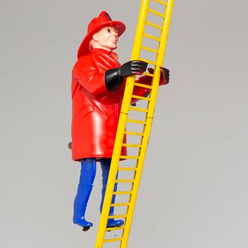 A tinplate Marx toys "The Climbing Fireman", 1950/60s.