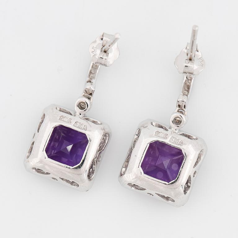 A pair of faceted amethyst and brilliant cut diamond earrings.