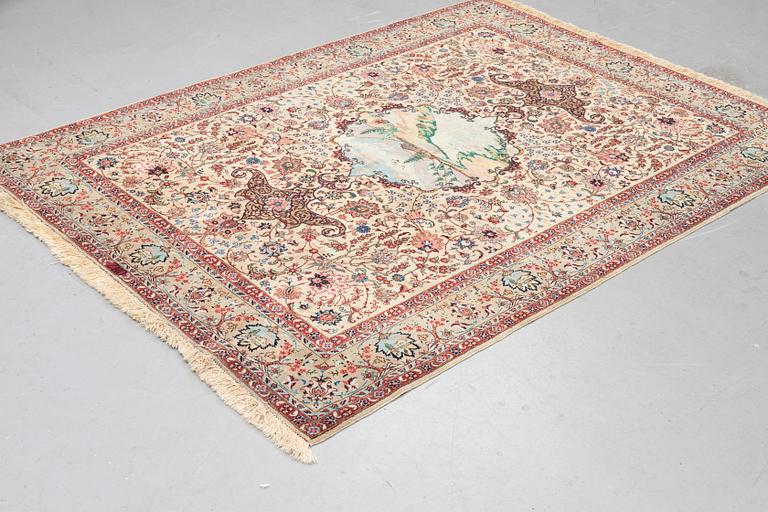 A carpet, semi-antique Tabriz, figural, signed, ca 234 x 170 cm.