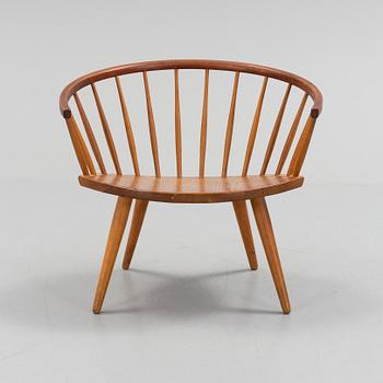 A teak 'Arka' armchair.
