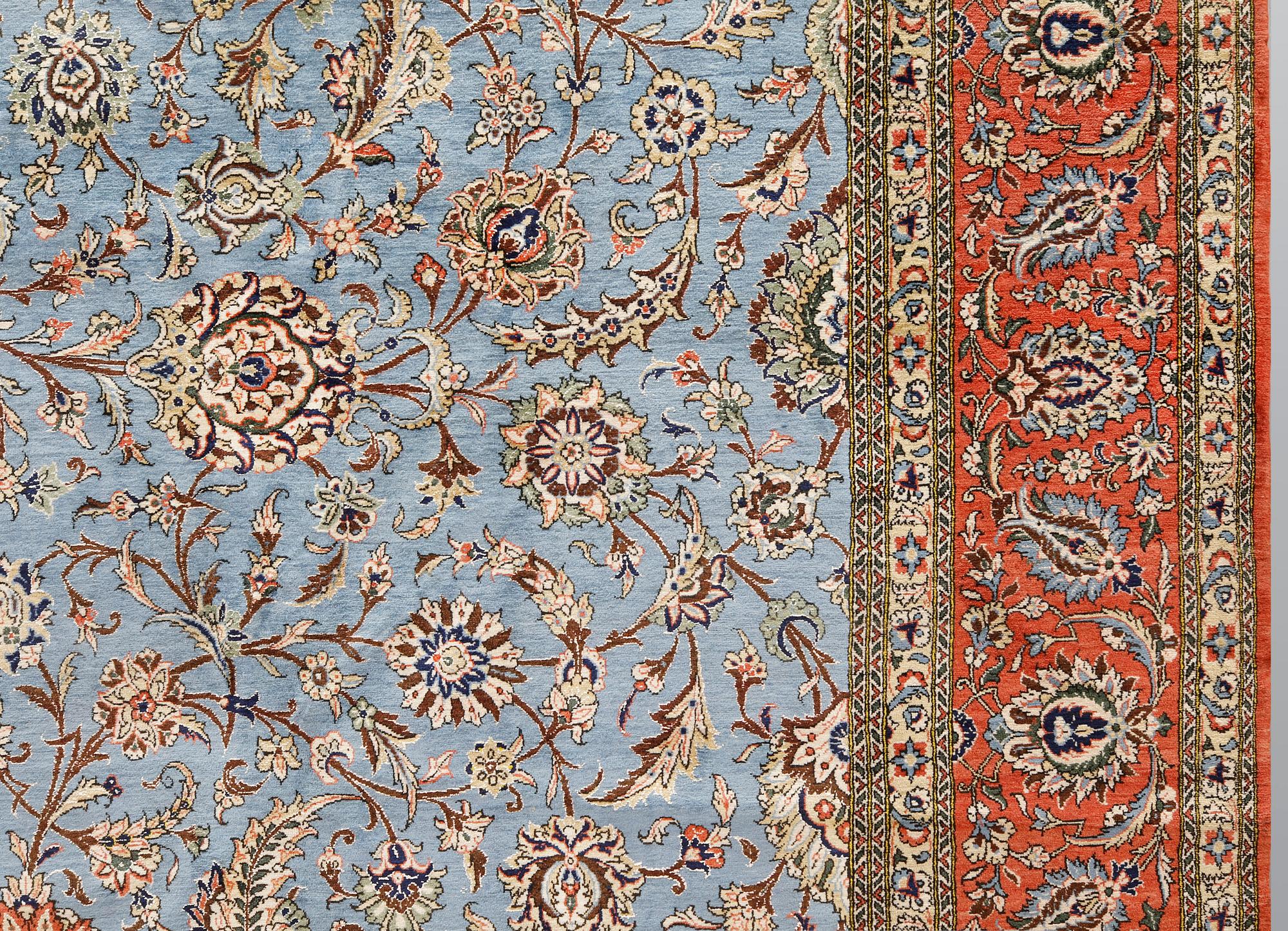 A Ghom carpet, part silk, approx. 480 x 350 cm.
