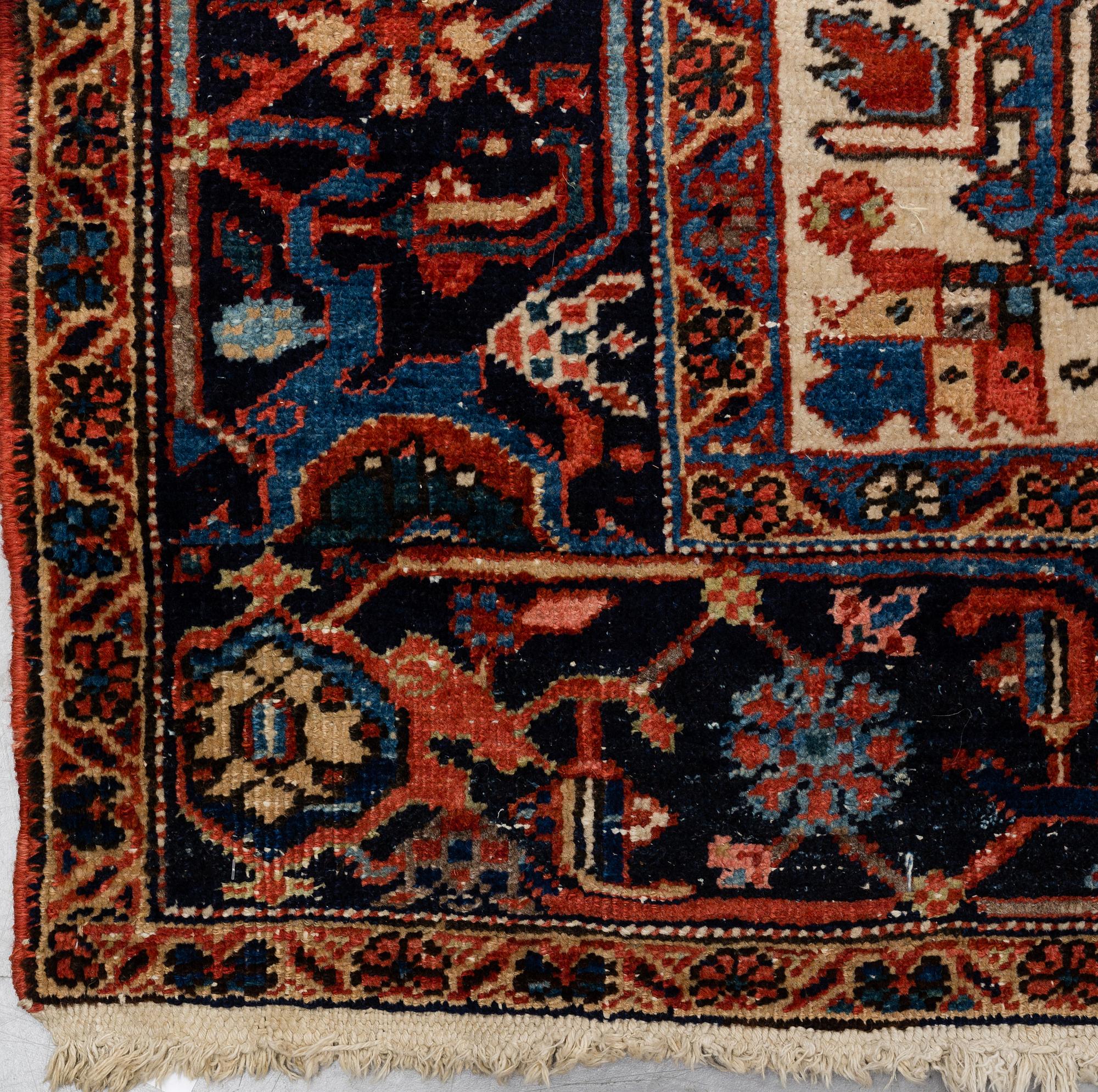 A CARPET, a semi-antique Heriz, ca 356,5-358,5 x 264 cm.