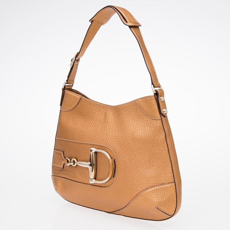 A Gold Leather Hasler Horsebit Hobo Bag.