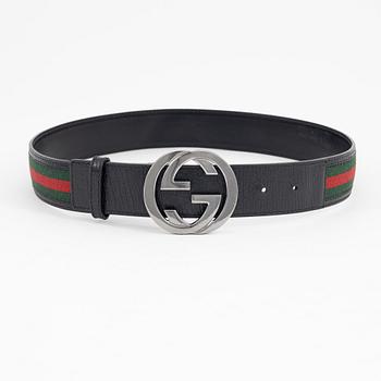Gucci, a leather and textile belt, size 80.