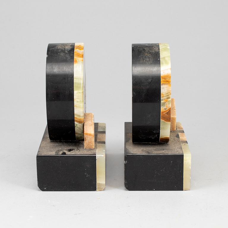 A pair of art déco onyx and marble book ends, 1930s.