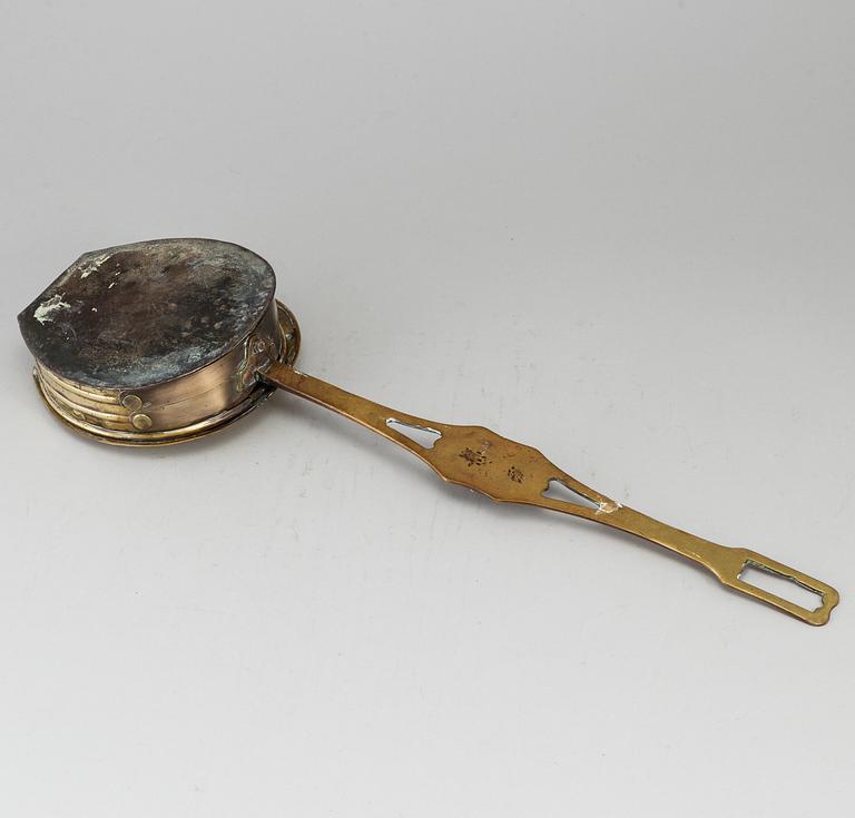A brass chestnut roaster, 19th century.