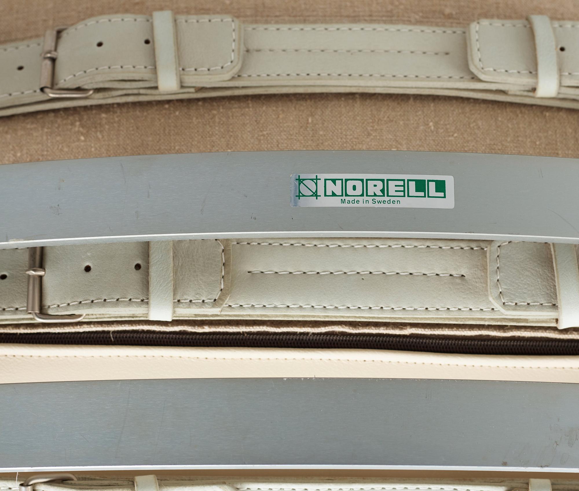 Arne Norell, "Ari", a pair of white leather easy chairs and one ottoman for Norell Möbel AB, Sweden.