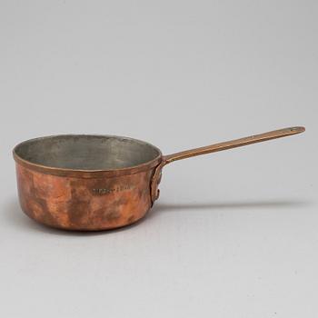 A copper saucepan marked FG 1756.