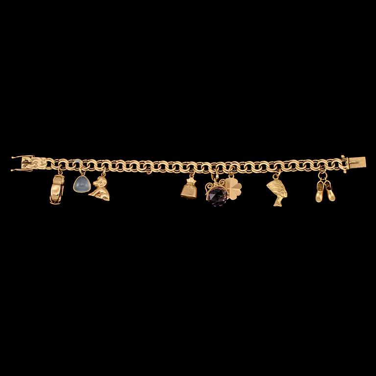 BERLOCKARMBAND, 18k guld med månsten och ametist, Gustav Dahlgren & Co, Malmö, 1963. Vikt 22 g.