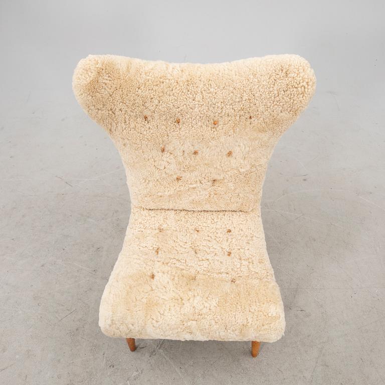 A Swedish Modern 1940s sheep skin armchair.