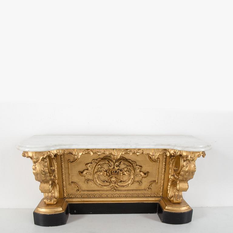 A late 19th century console table with a marble top.