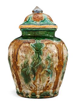 1464. A green, brown and white glazed jar, Ming dynasty (1368-1644).
