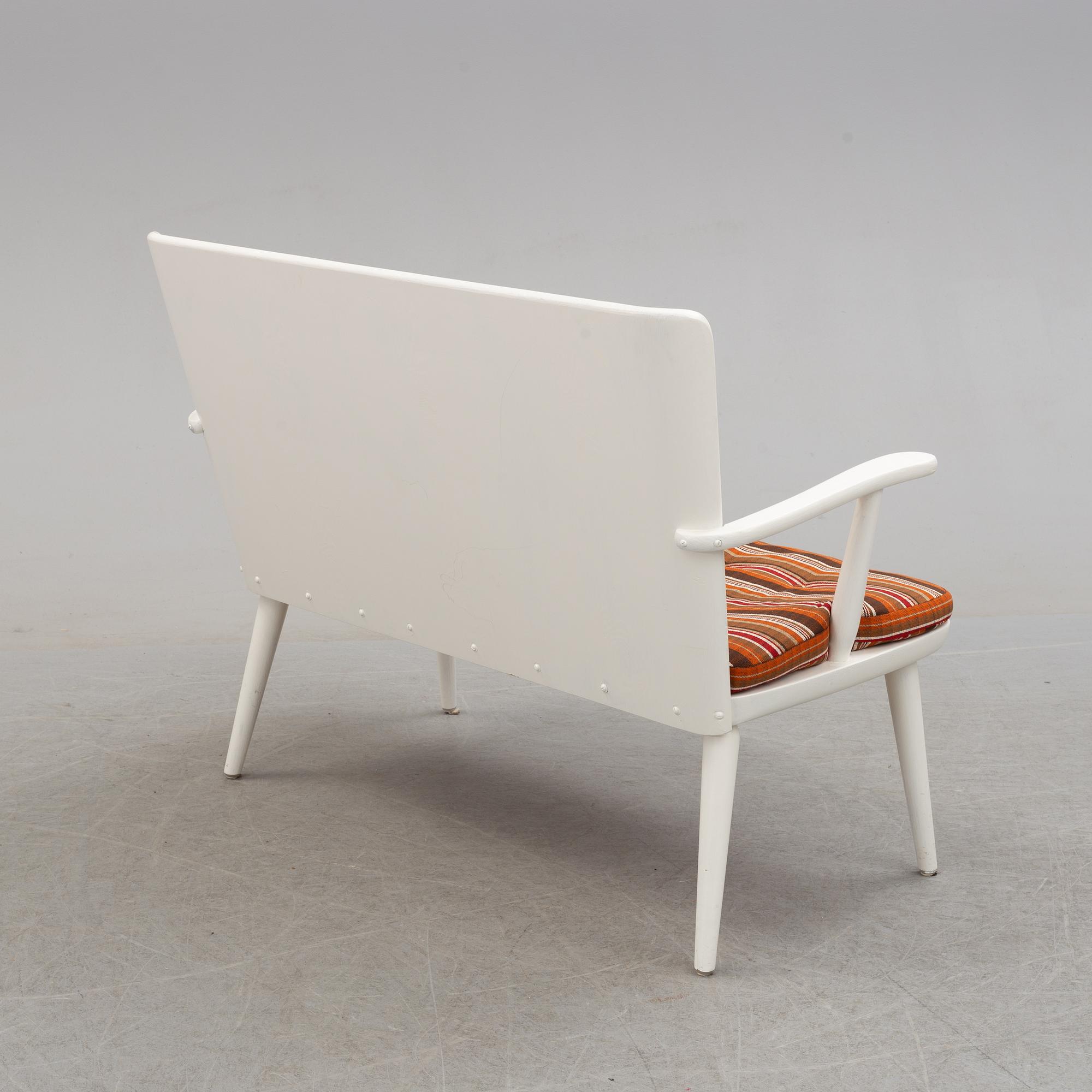 A second half of the 20th century sofa, pair of armchairs and coffee table by Göran Malmvall.