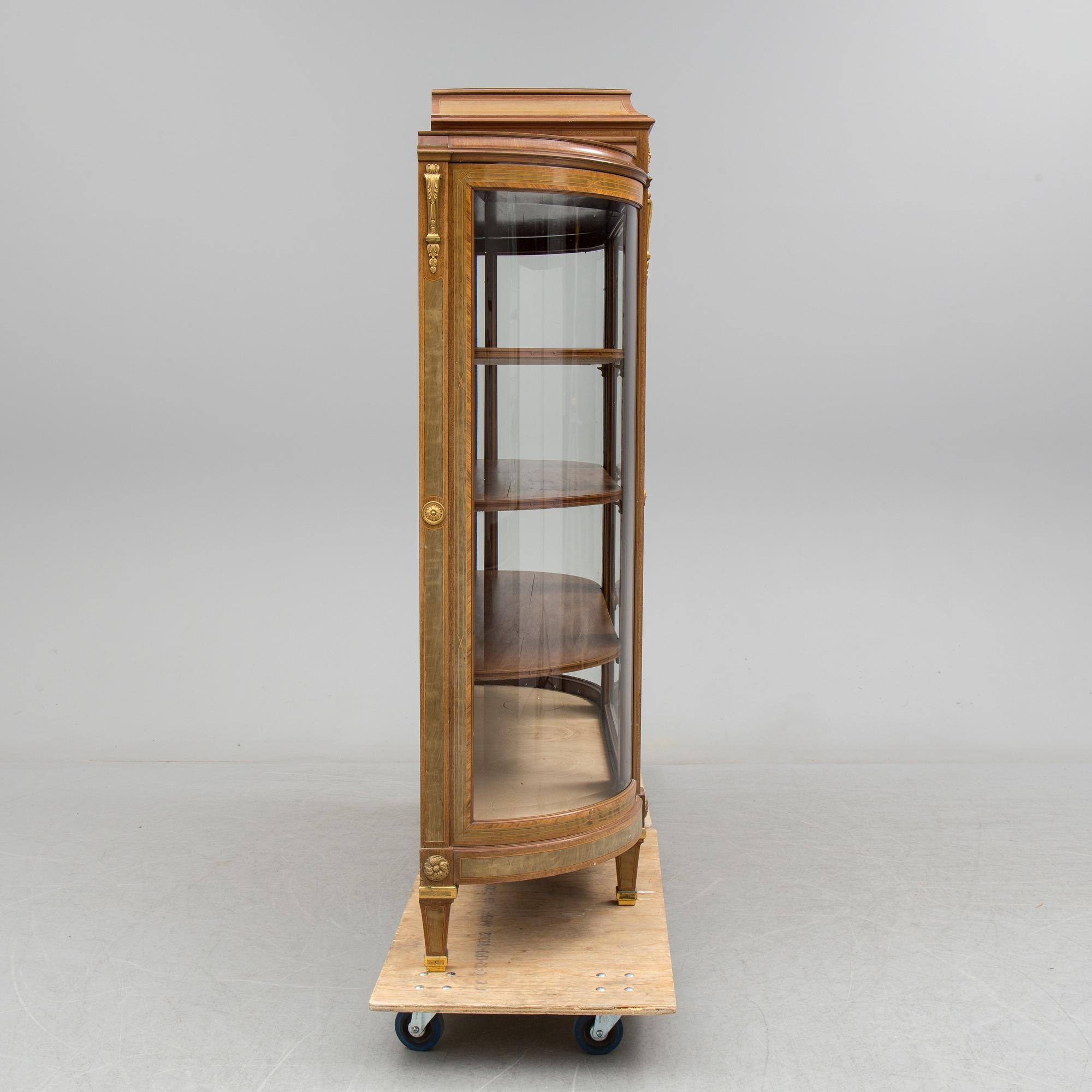 A DISPLAY CABINET, gustavian style, signed with label: "Gustaf L Sahlholm Snickare i Stockholm 25/5 1910".