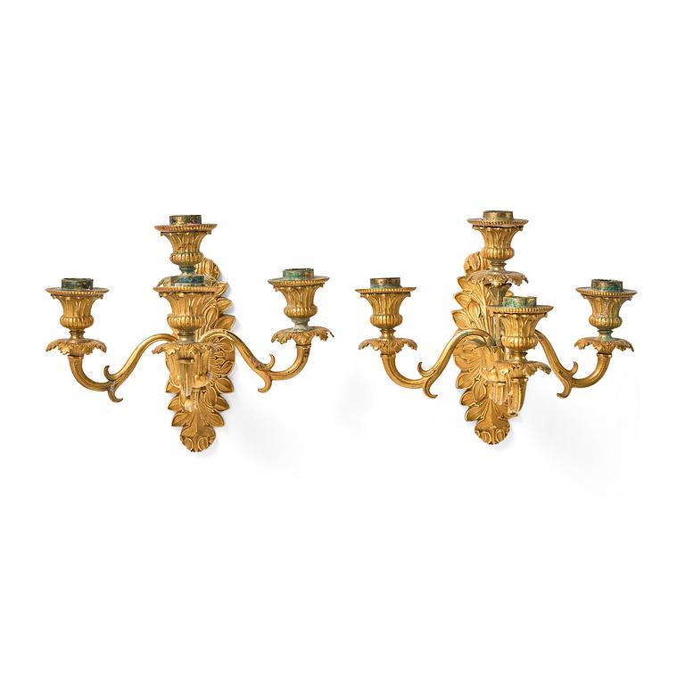 A pair of late Empire ormolu four-branch wall lights, circa 1840.