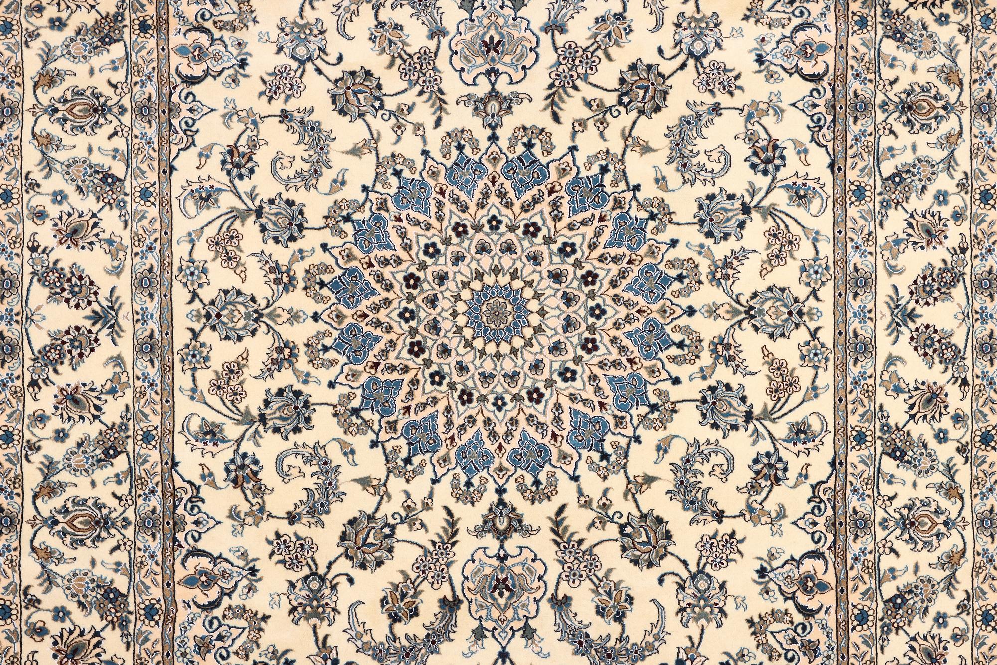 A Nain, part silk carpet, c. 337 x 244 cm.