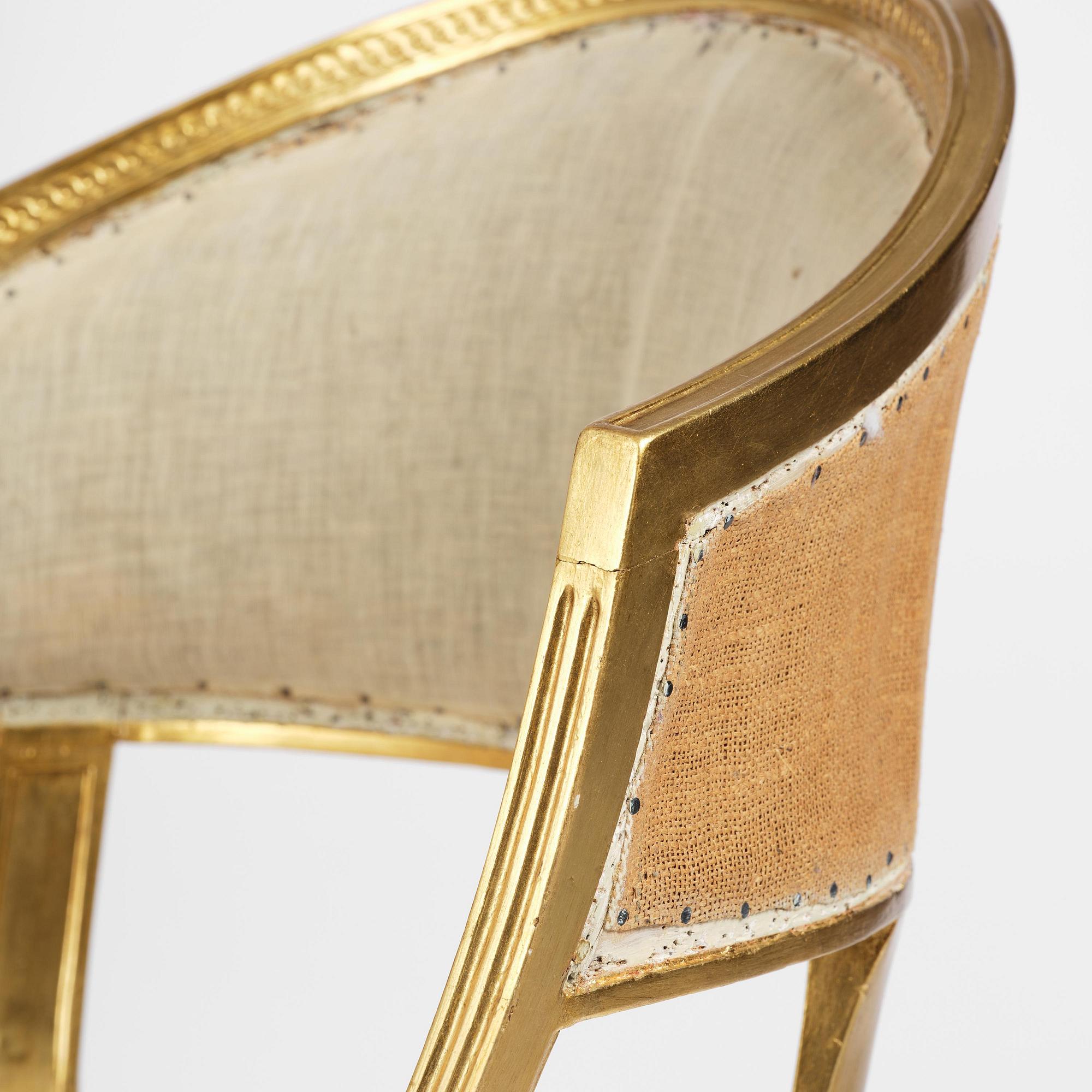 A pair of late Gustavian giltwood open-back armchairs, Stockholm, late 18th century.