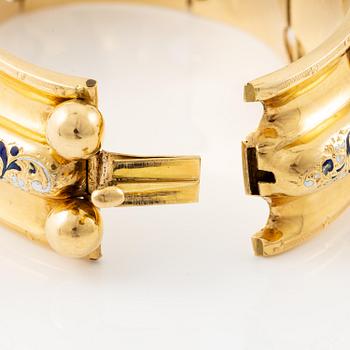 A bracelet 18K gold with enamel details.