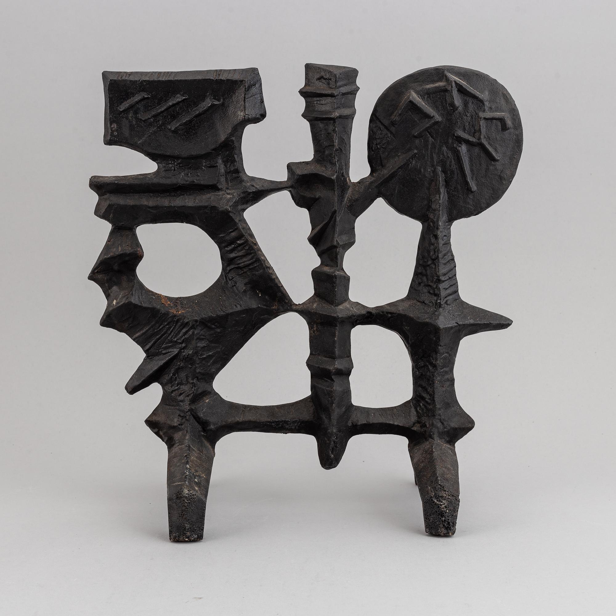 OLLE HERMANSSON, a cast iron sculpture, marked Husqvarna.