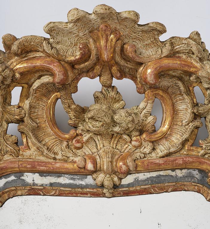 A Swedish gitlwood rococo mirror, Stockholm, later part 18th century.