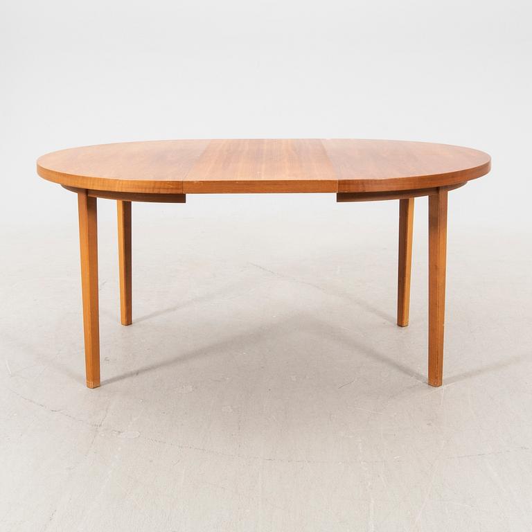 A 1960s teak dining table.