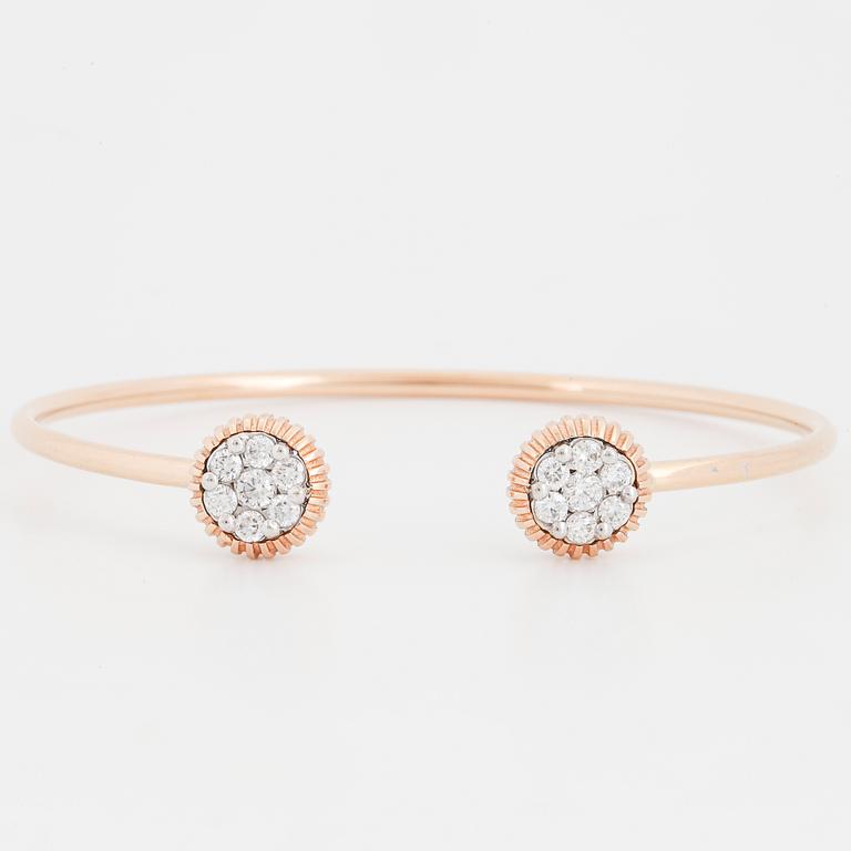 An 18K rose gold bracelet set with round brilliant-cut diamonds.
