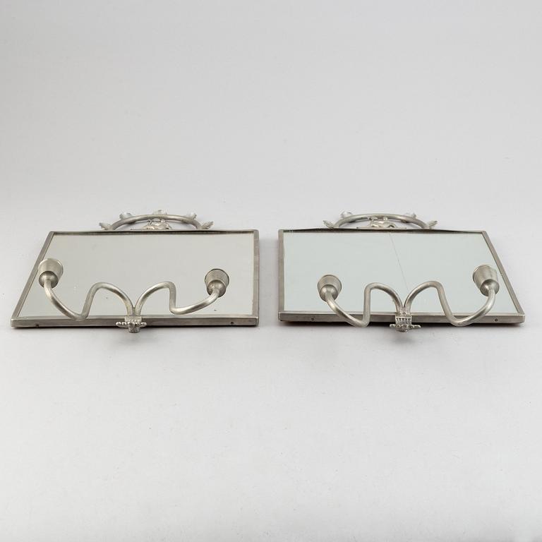 Two pewter wall sconces from Firma Svenskt Tenn, 1925.