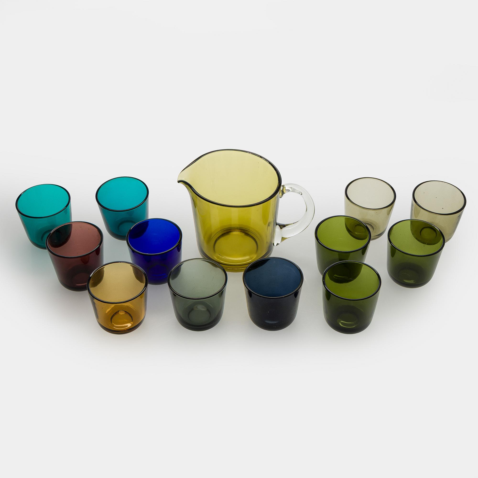 Kaj Franck, a mid-20th century "5601" glass pitcher and a twelve "5023" glasses, Nuutajärvi, Finland.