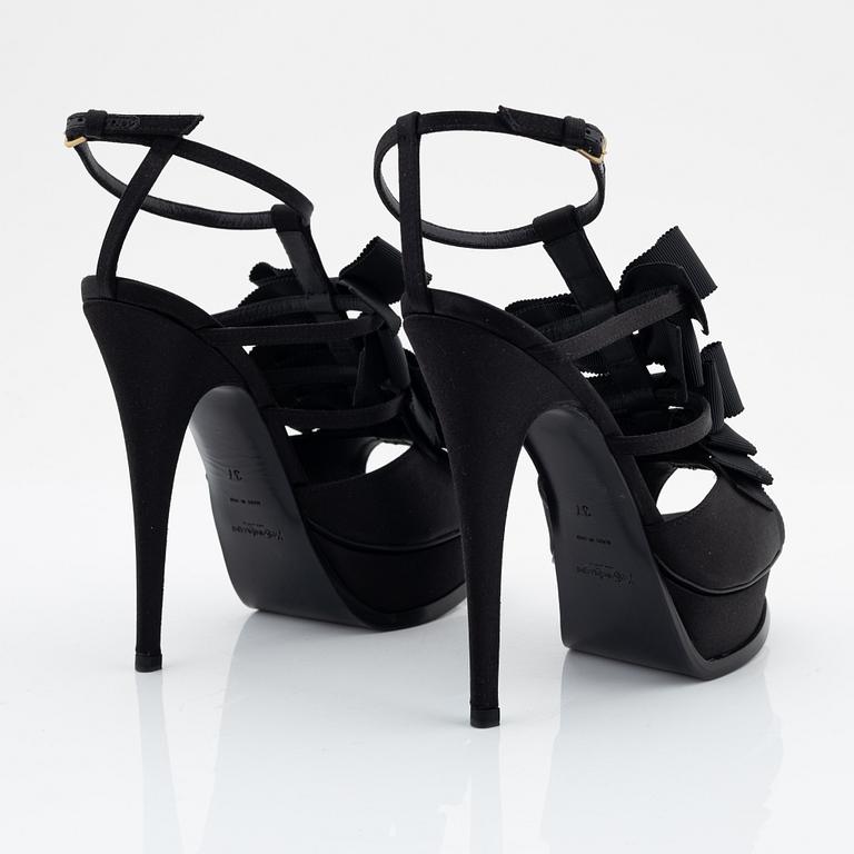 Yves Saint Laurent, a pair of black silk and bows platform sandals, size 37.