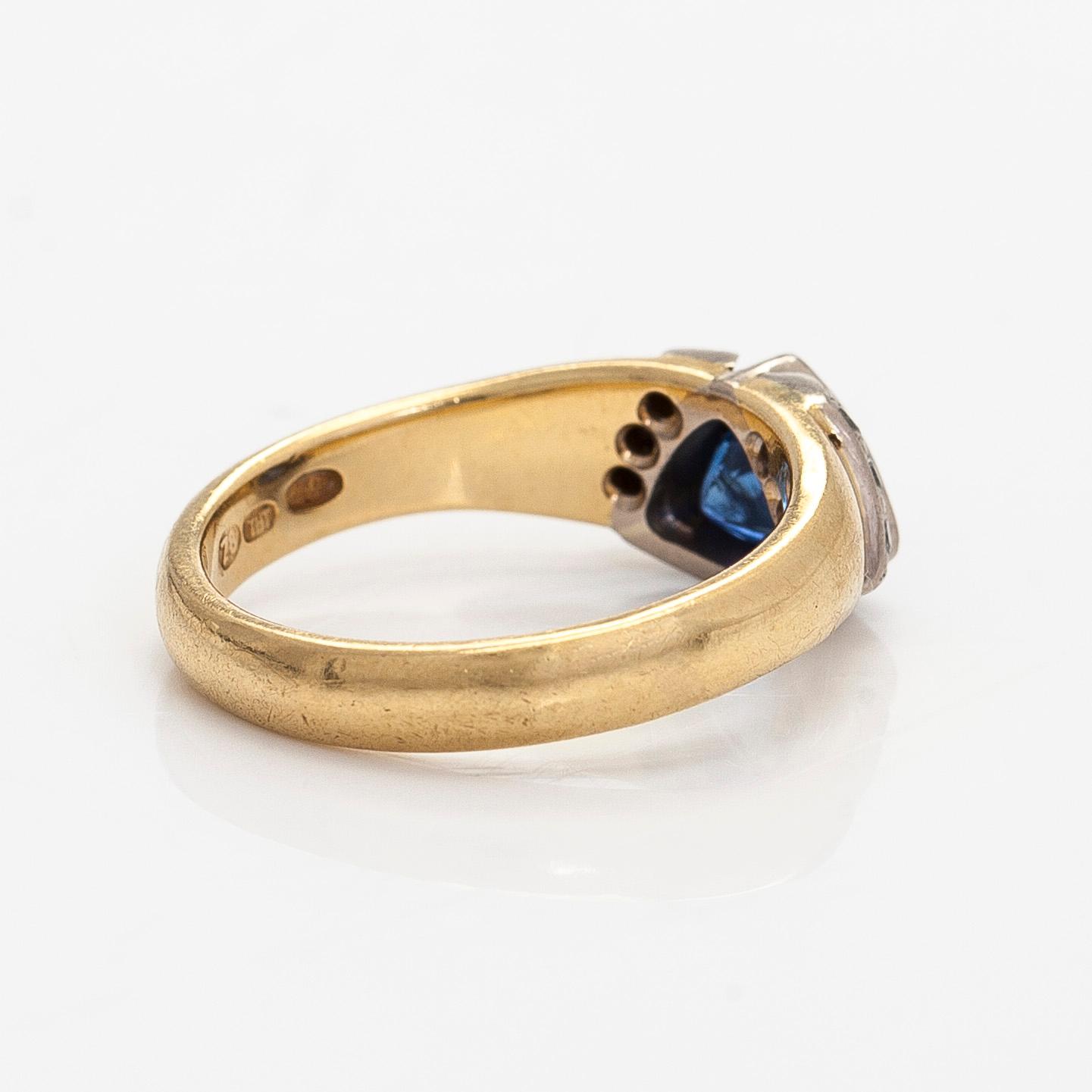 Ring, faceted sapphire, diamonds, 18K gold, H. Tuomaala, Finland 2001.