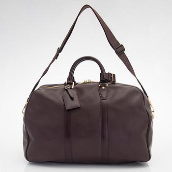 Louis Vuitton, a 'Taiga Kendall PM' weekend bag.