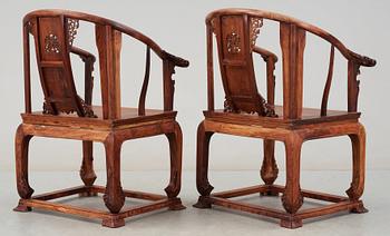 A pair of hardwood horseshoeback armchairs, late Qing dynasty, circa 1900.