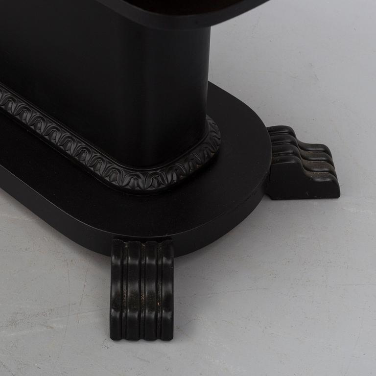 a coffee table from the first half of the 20th century.