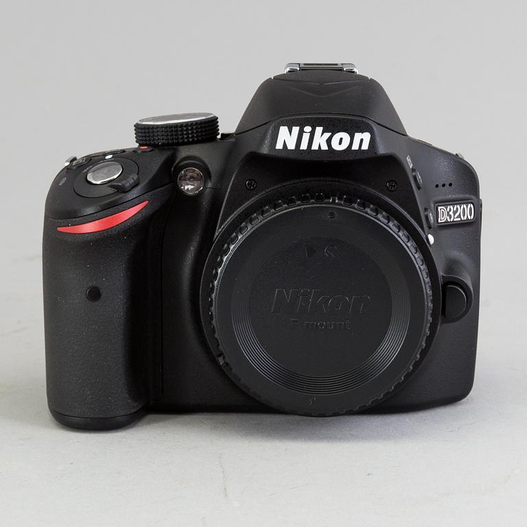 a digital black body D3200 Nikon camer with a nikon AF-S Nikkor  18-55 mm 1:3.5-5.6G VR II lens.