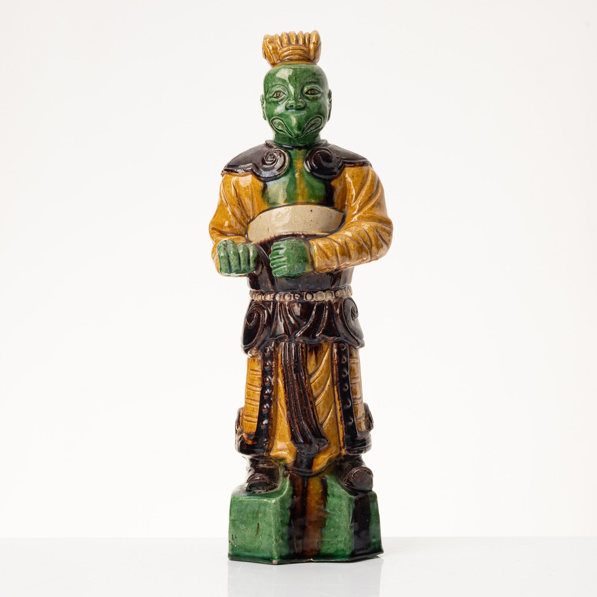 A stoneware figurine, China, Ming style but 20th century.