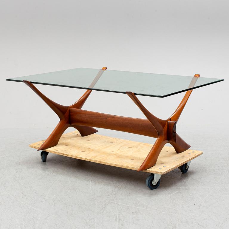 A glass top coffee table by Fredrik Schriever Abeln.
