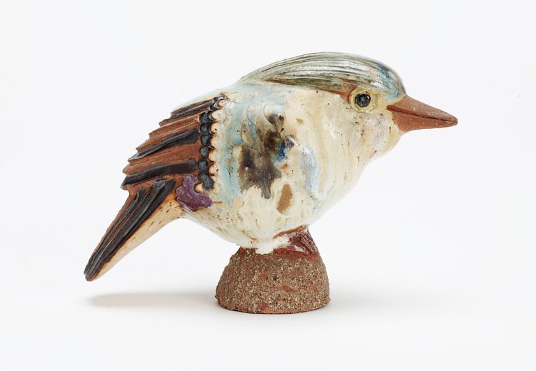 A Tyra Lundgren stoneware bird, signed with a seal.