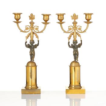 A pair of Empire gilt-brass two-branch candelabra, Stockholm, early 19th century.
