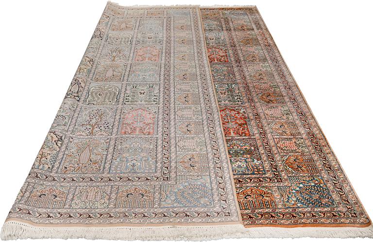 A silk Kashmir carpet, approx. 327 x 243 cm.