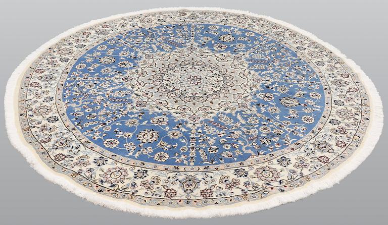 A round part silk Nain rug, so called 9 LAA, diameter 195 cm.