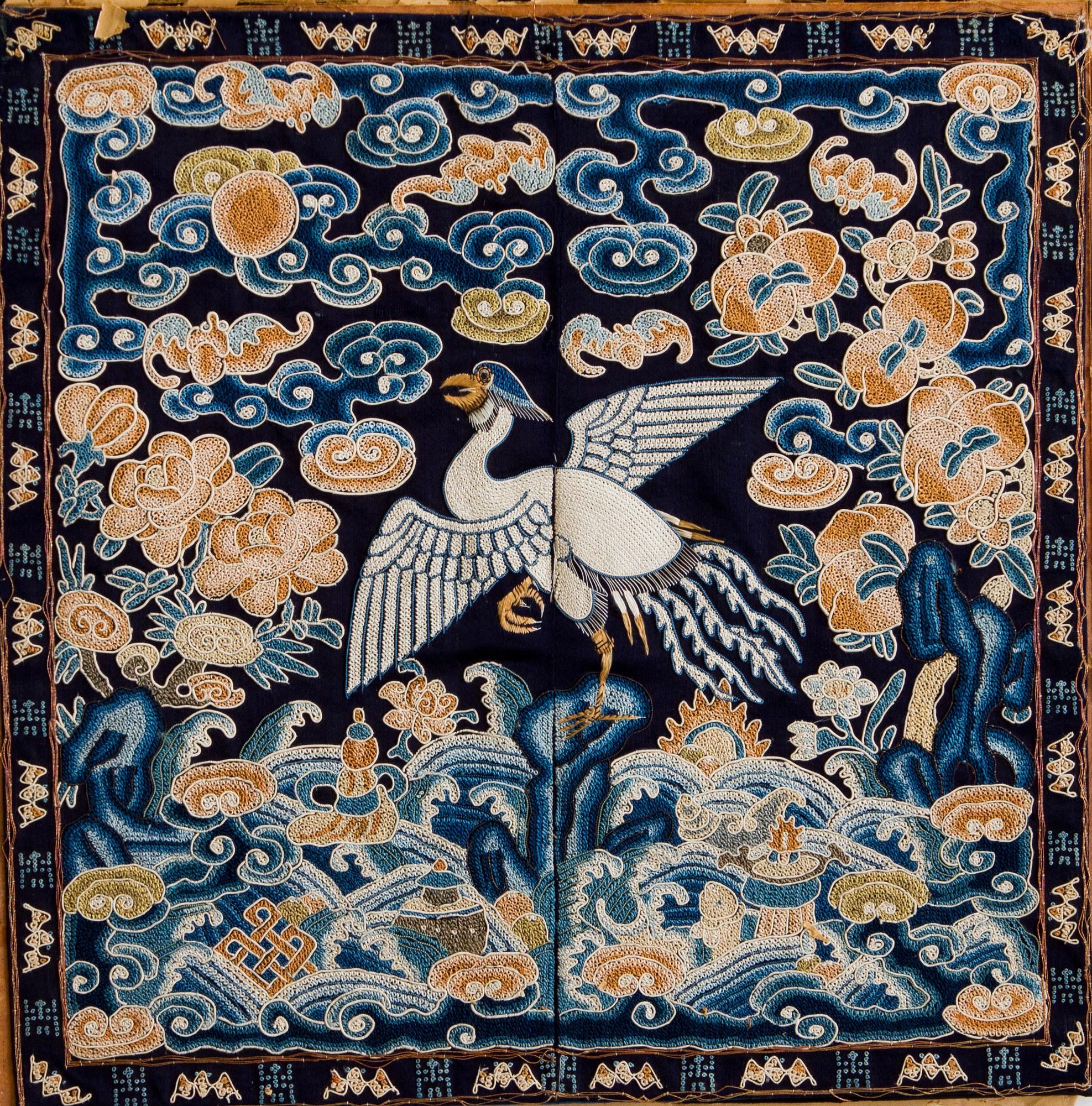 A civil offical's rank badge with a silver pheasant in Peking knot, Qing dynasty, early 19th century.
