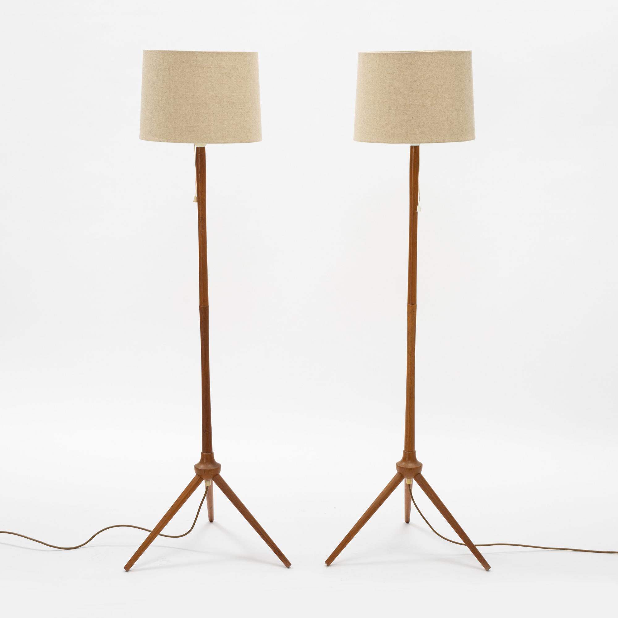 A pair of teak floor lamps, mid 20th century.