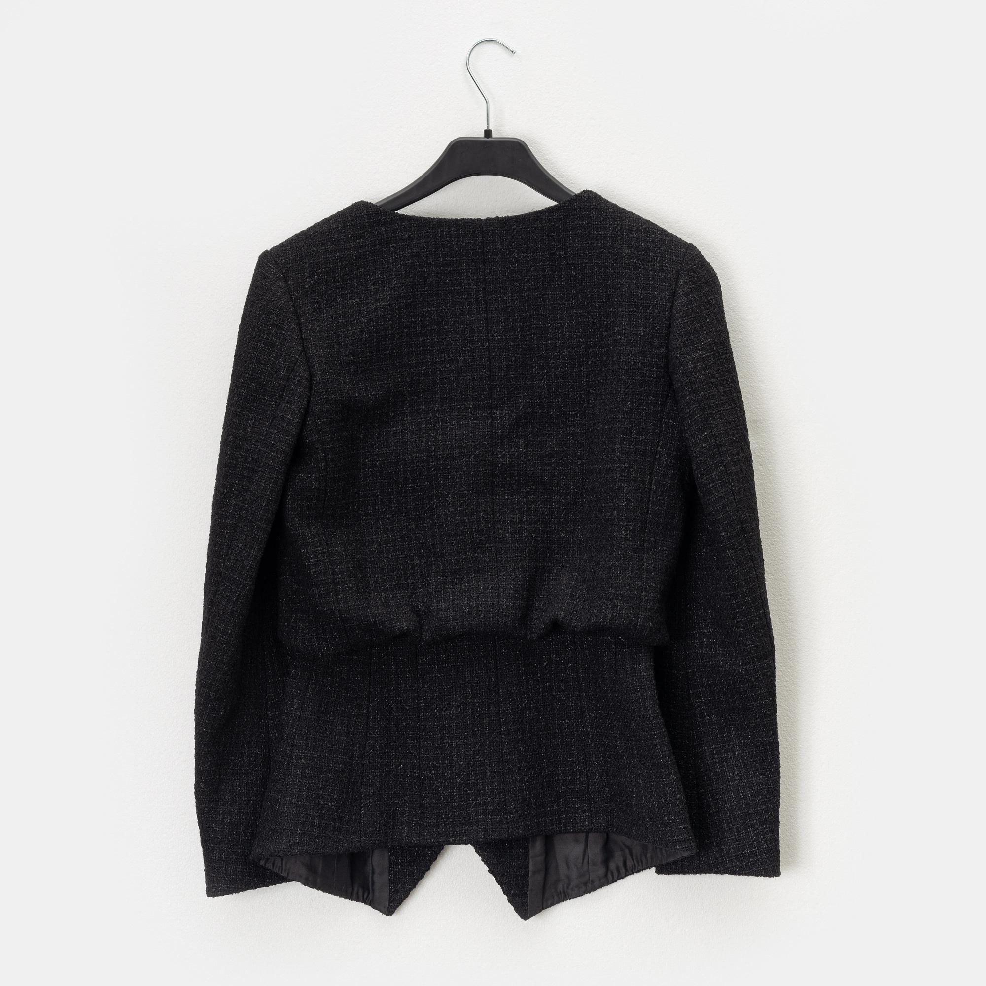 Chanel, A black bouclé jacket, size 34.