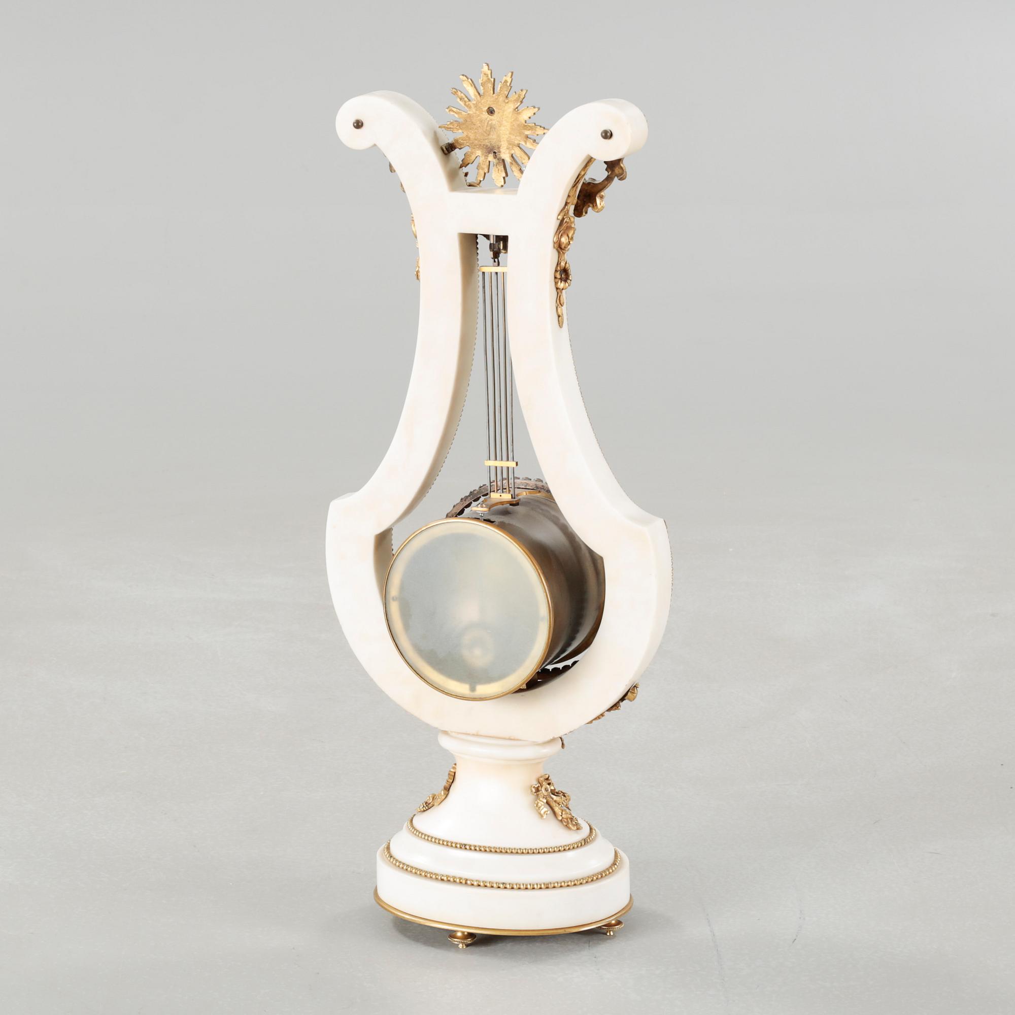 A table clock, dial marked "Gilles l'Ainé Paris", made around year 1900.